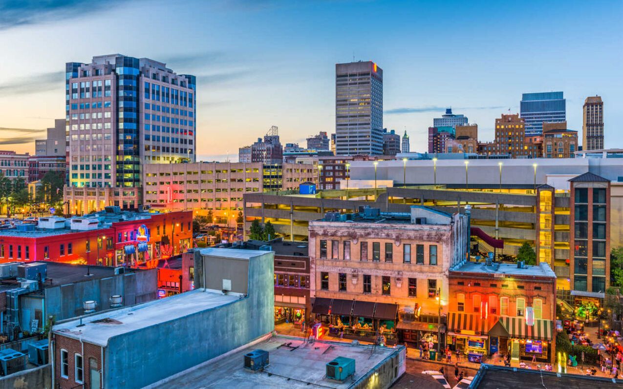 Downtown Memphis buildings lit up at dusk